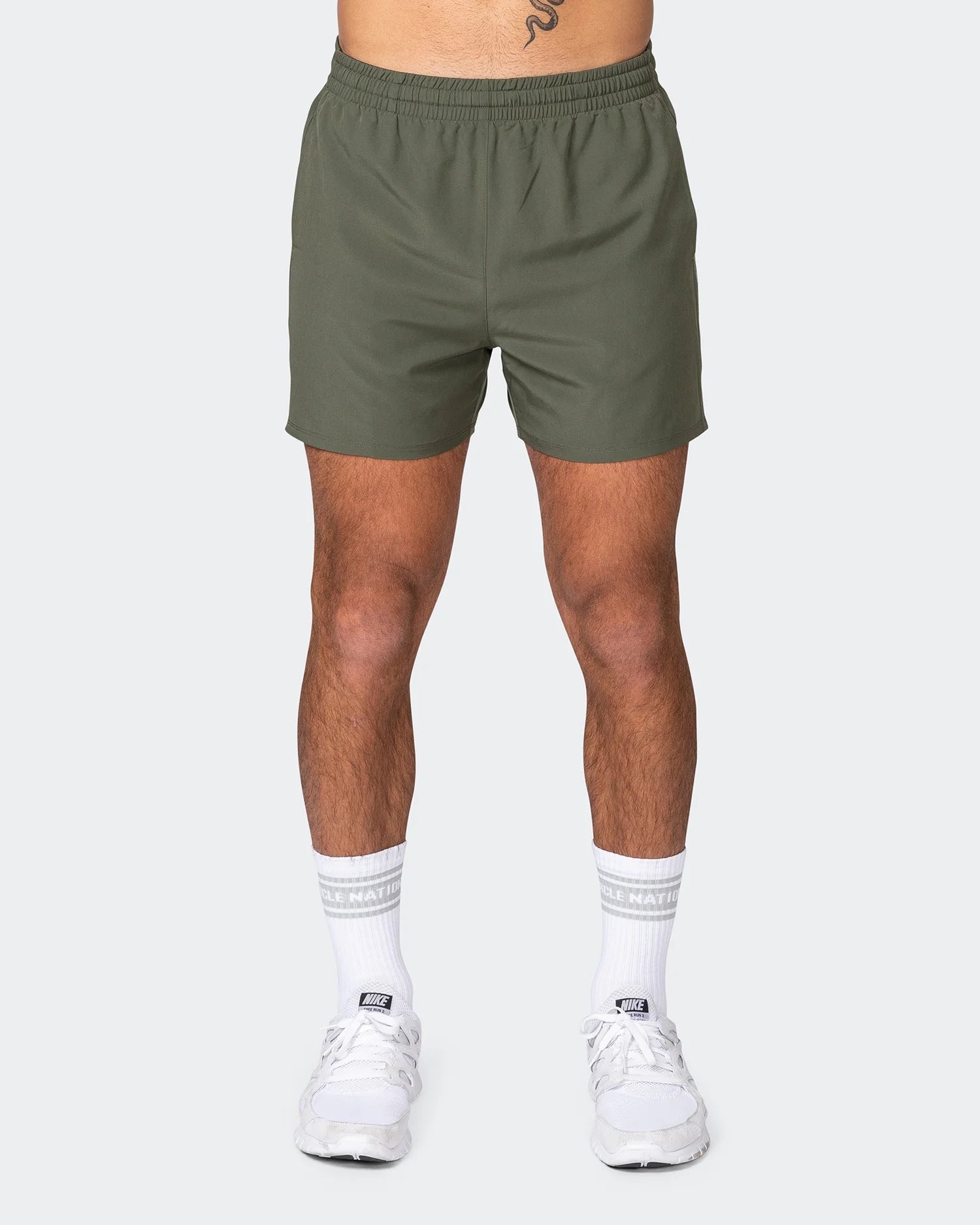 Men's ripped denim shorts for a trendy streetwear aestheticMuscle Nation | Function 4" Shorts - Dark Khaki